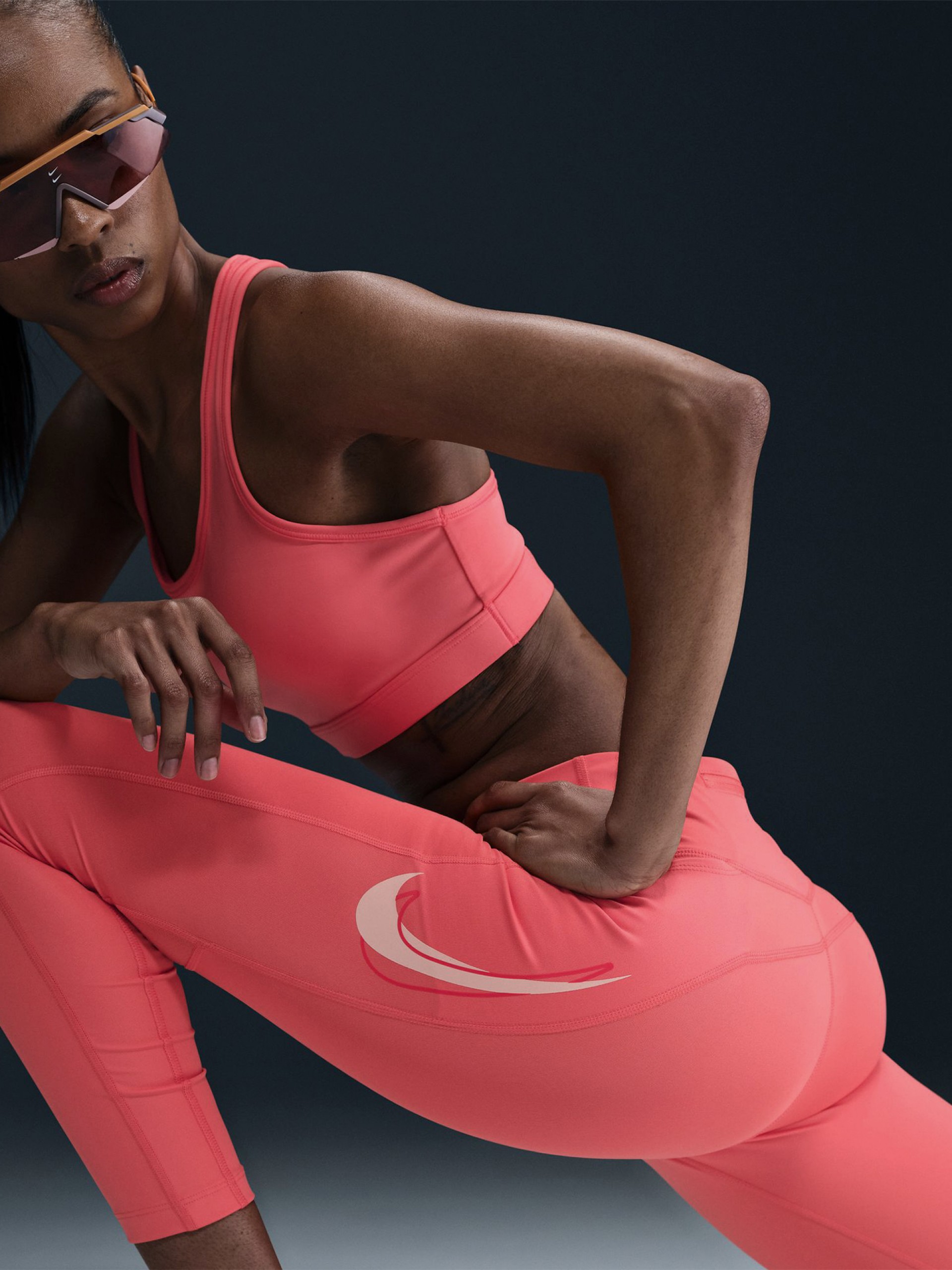 Leggings Nike Dri-FIT Fast Mid-Rise 7/8 Salmão Para Mulher
