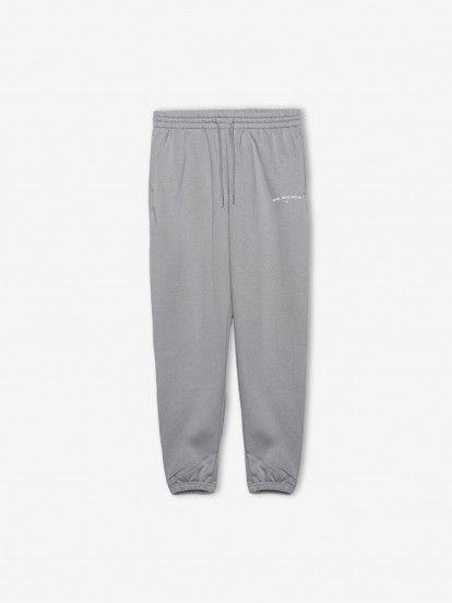 Pantalones New Balance Reimagined Graphic Fleece Jogger Grises