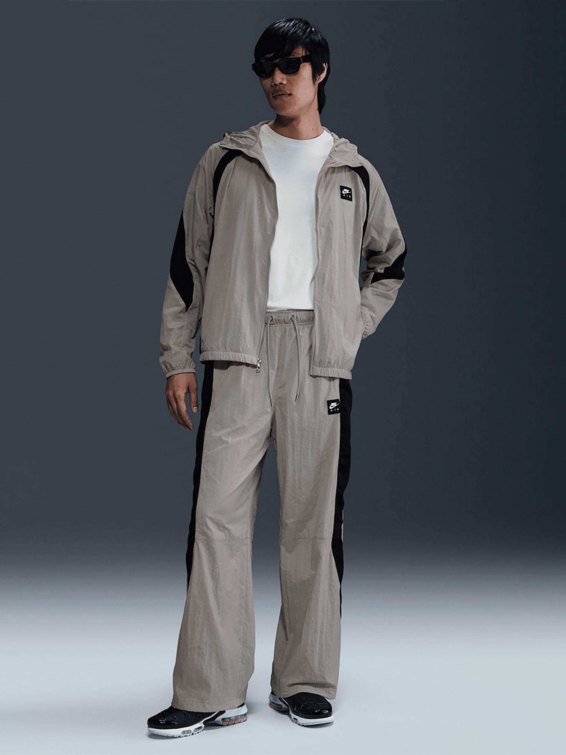 Pantalones Nike Air Woven Grises y Negros Para Hombre