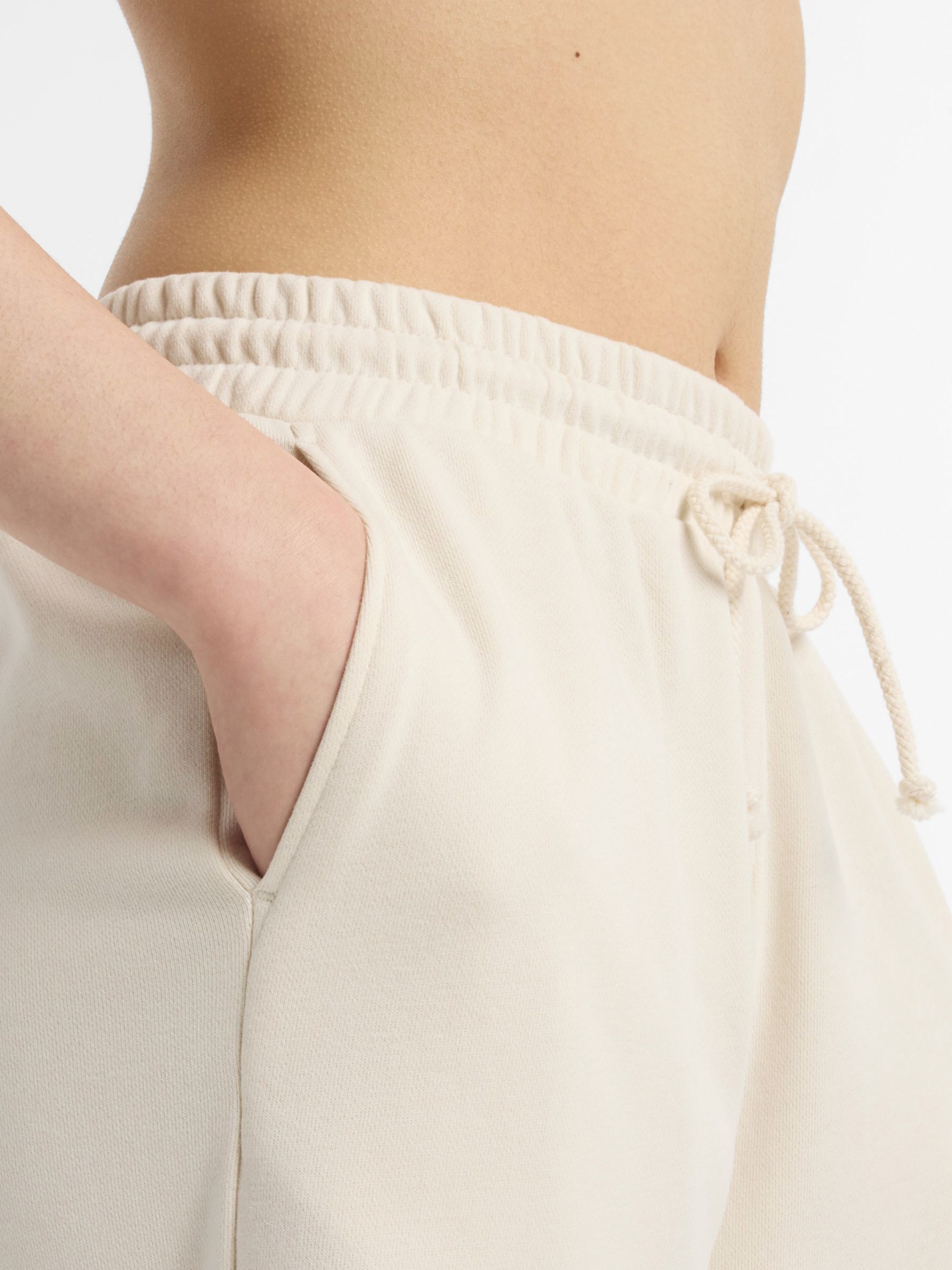 Pantalones New Balance Coastal Fleece Beige