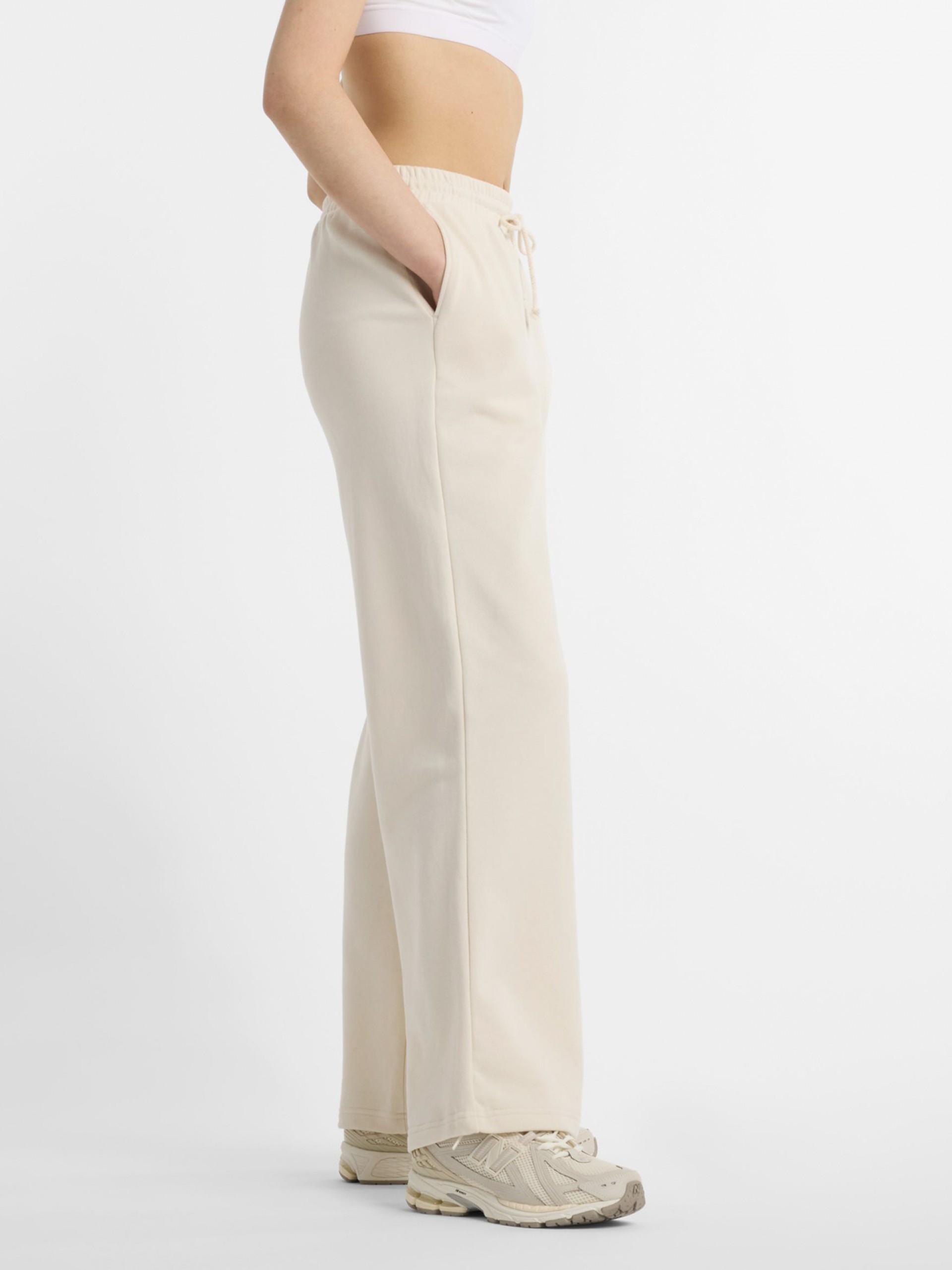 Pantalones New Balance Coastal Fleece Beige